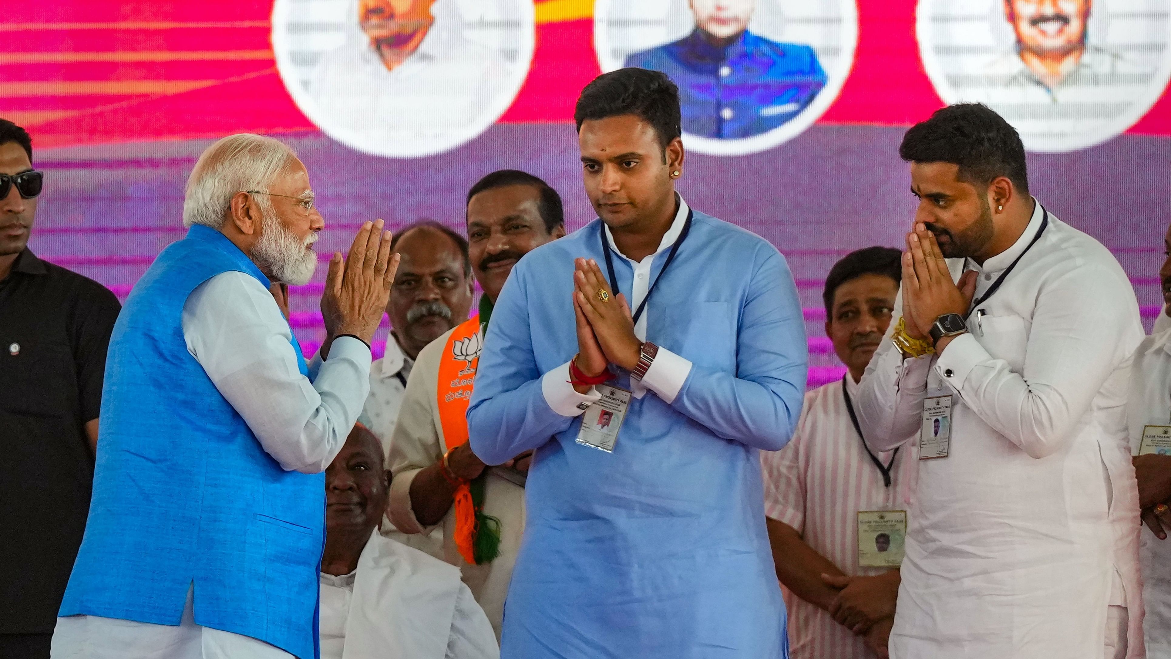 <div class="paragraphs"><p>File Photo: Prime Minister Narendra Modi with BJP Mysuru candidate Yaduveer and NDA candidate from Hassan Prajwal Revanna at an election campaign rally ahead of Lok Sabha election, in Mysuru, Sunday, April 14, 2024. </p></div>