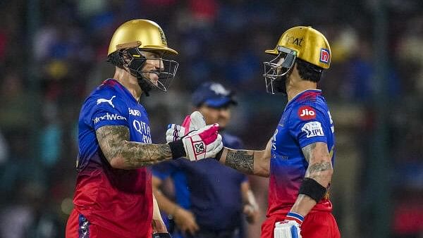 <div class="paragraphs"><p>Royal Challengers Bengaluru batter Faf du Plessis being gretted by Virat Kohli on his fifty during the Indian Premier League.</p></div>