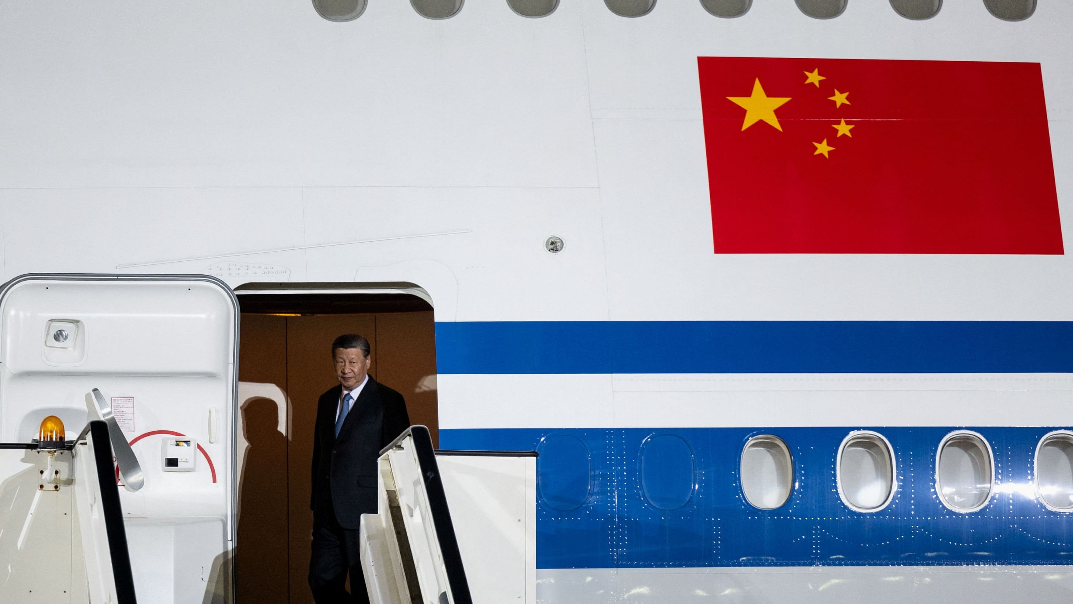 <div class="paragraphs"><p>China's President Xi Jinping disembarks as he arrives for an official two-day state visit, at Nikola Tesla Airport in Belgrade.</p></div>