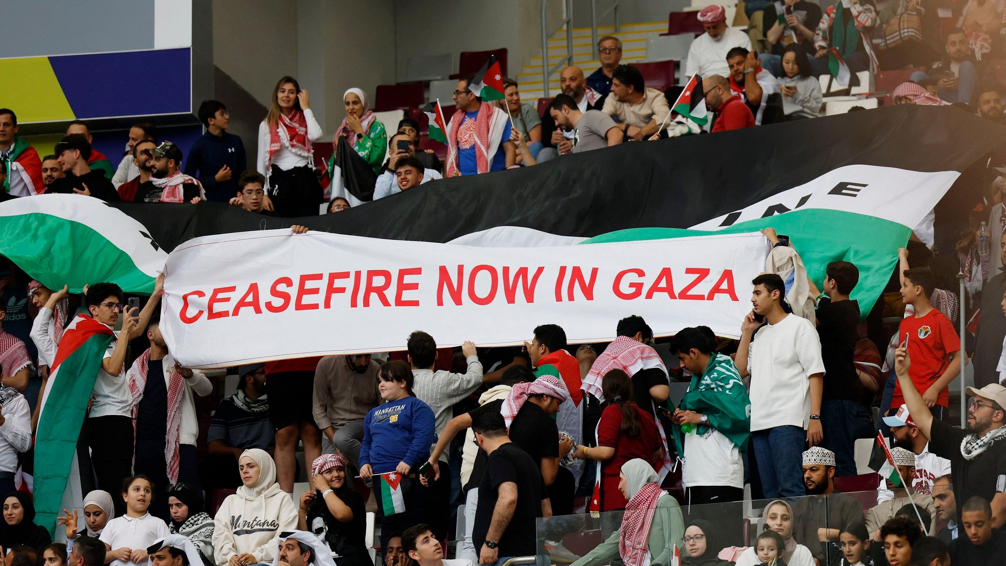 <div class="paragraphs"><p>People display a banner reading 'Ceasefire now in Gaza', as the conflict between Israel and the Palestinian Islamist group Hamas continues.</p></div>