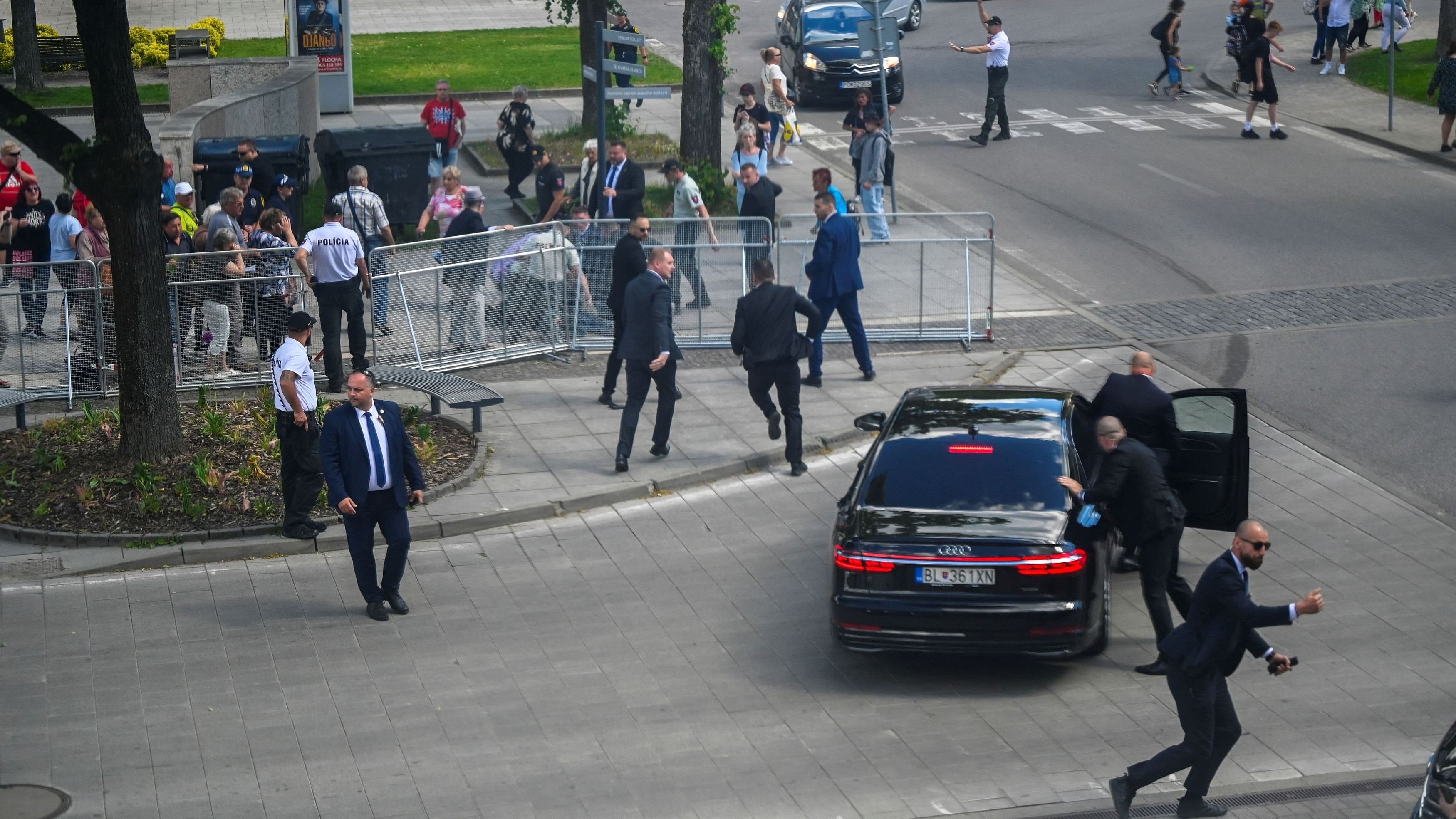 <div class="paragraphs"><p>Security officers move Slovak PM Robert Fico in a car after a shooting incident, after a Slovak government meeting in Handlova, Slovakia, May 15, 2024. </p></div>