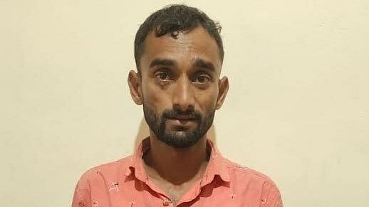 <div class="paragraphs"><p>The police had received a tip off that Prakash(in the picture) was hiding in a forest after committing the crime from where they arrested him.</p></div>