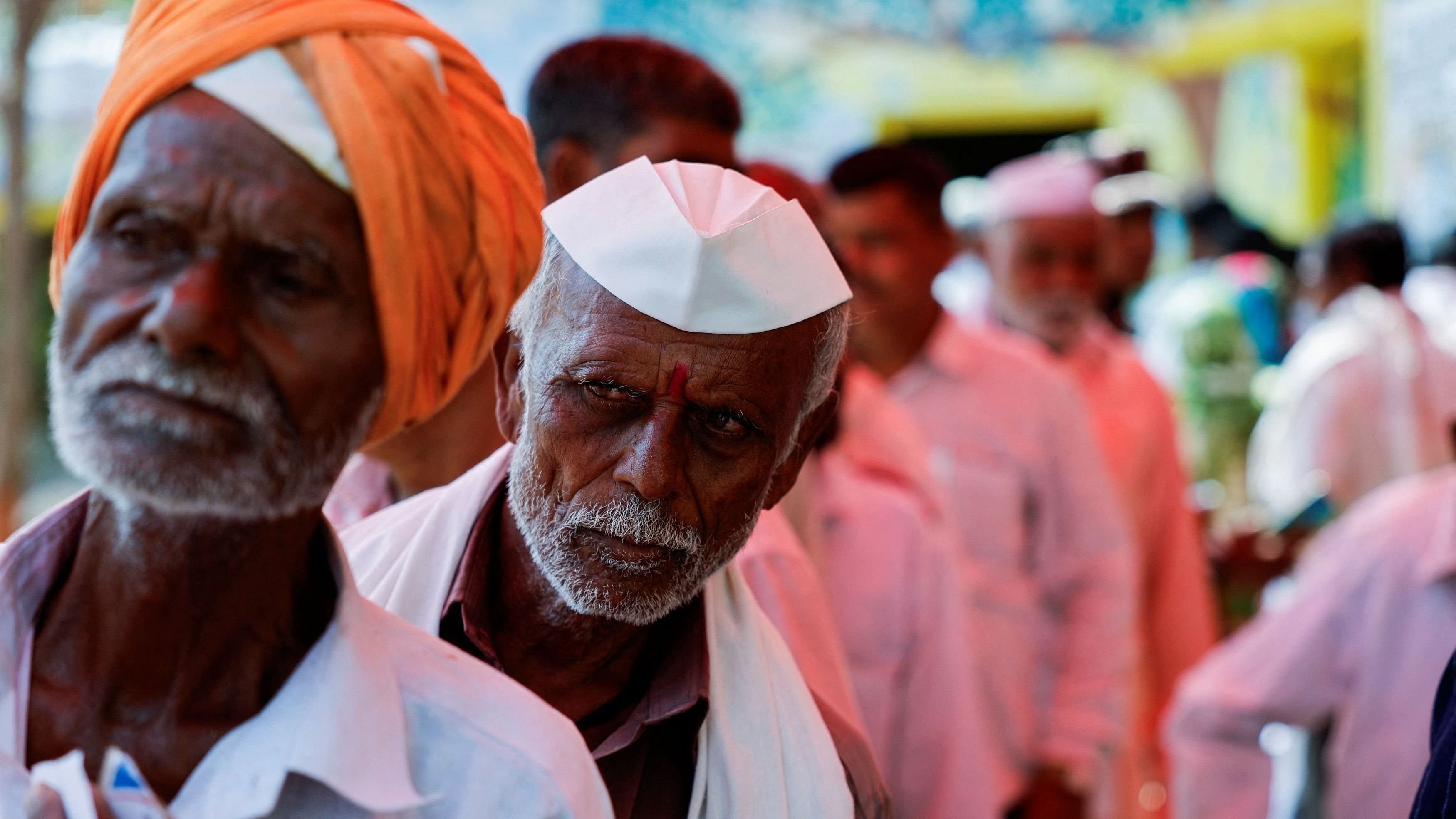 <div class="paragraphs"><p>People stand in line to vote during the fifth phase of the general election at a polling station, Maharashtra.</p></div>