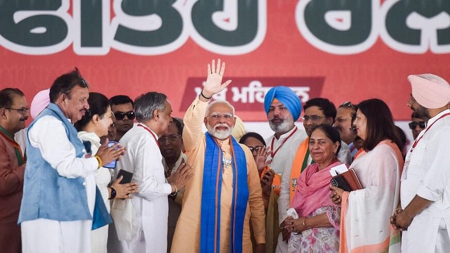 <div class="paragraphs"><p>Prime Minister Narendra Modi waves at crowd during a public meeting for Lok Sabha elections, in Hoshiarpur, Punjab.</p></div>