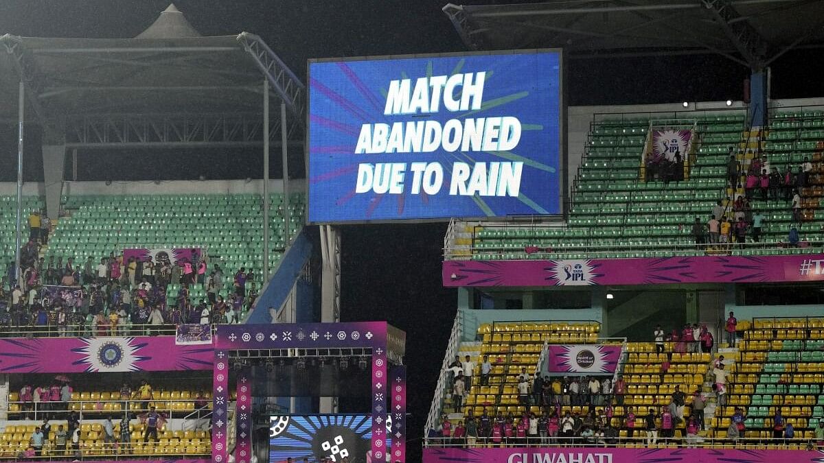 <div class="paragraphs"><p>Fans at the stand after the Indian Premier League (IPL) 2024 T20 cricket match between Rajasthan Royals and Kolkata Knight Riders was abandoned due to rain without a ball bowled as displayed on the big screen, at the ACA Stadium, Barsapara, in Guwahati, Sunday, May 19, 2024.</p></div>