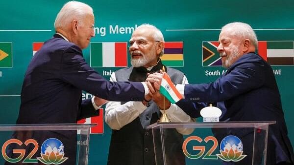 <div class="paragraphs"><p>US President Joe Biden, Indian Prime Minister Narendra Modi and Brazilian President Luiz Inacio Lula da Silva hold hands as they attend the launch of the Global Biofuels Alliance at the G20 summit in New Delhi, India.</p></div>