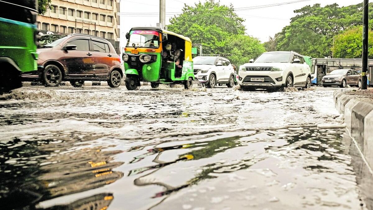 <div class="paragraphs"><p>Vehicles ply on a water logged road in Bengaluru as the city received rainfall on Friday.&nbsp;</p></div>