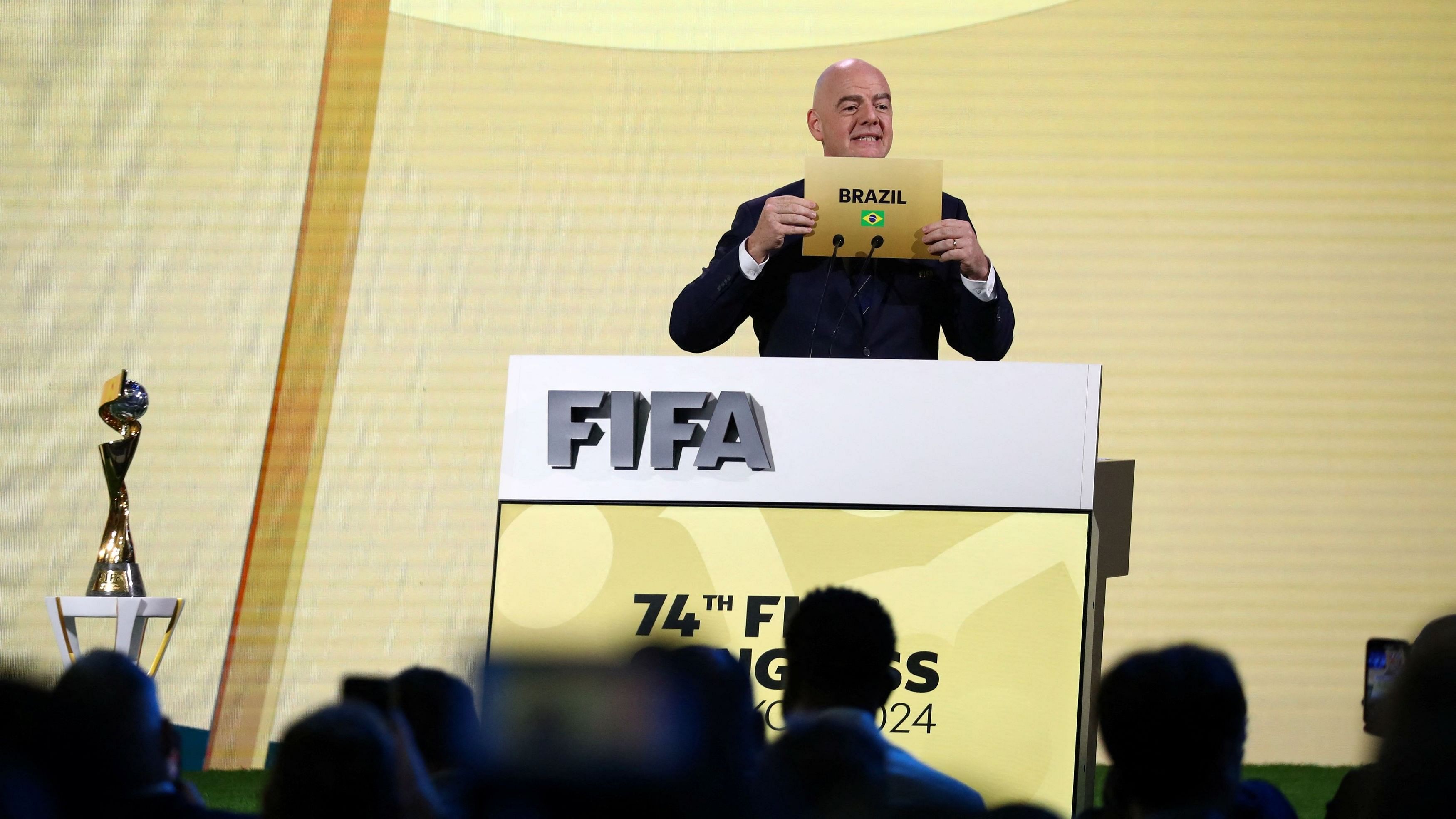 <div class="paragraphs"><p>FIFA President Gianni Infantino unveils Brazil as the winner of the bid to host the Women's World Cup, during the 74th FIFA Congress at the Queen Sirikit National Convention Center in Bangkok, Thailand on Friday.</p></div>