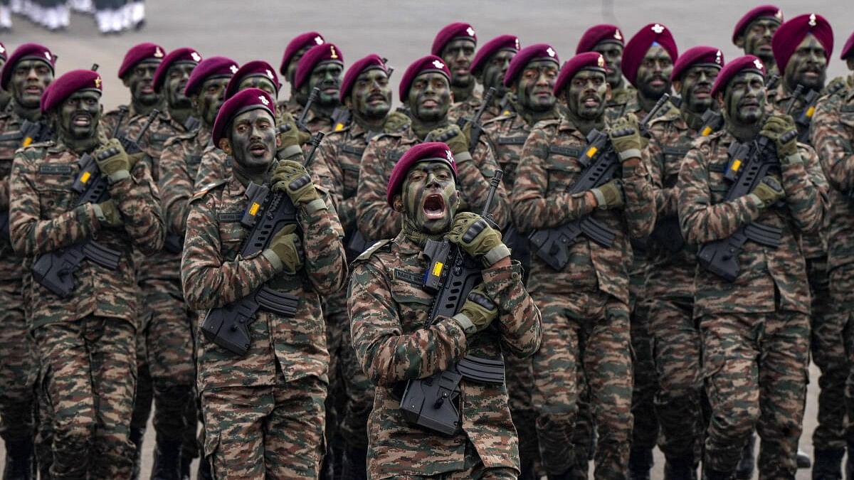 <div class="paragraphs"><p> A contingent marches past during Army day celebrations</p></div>