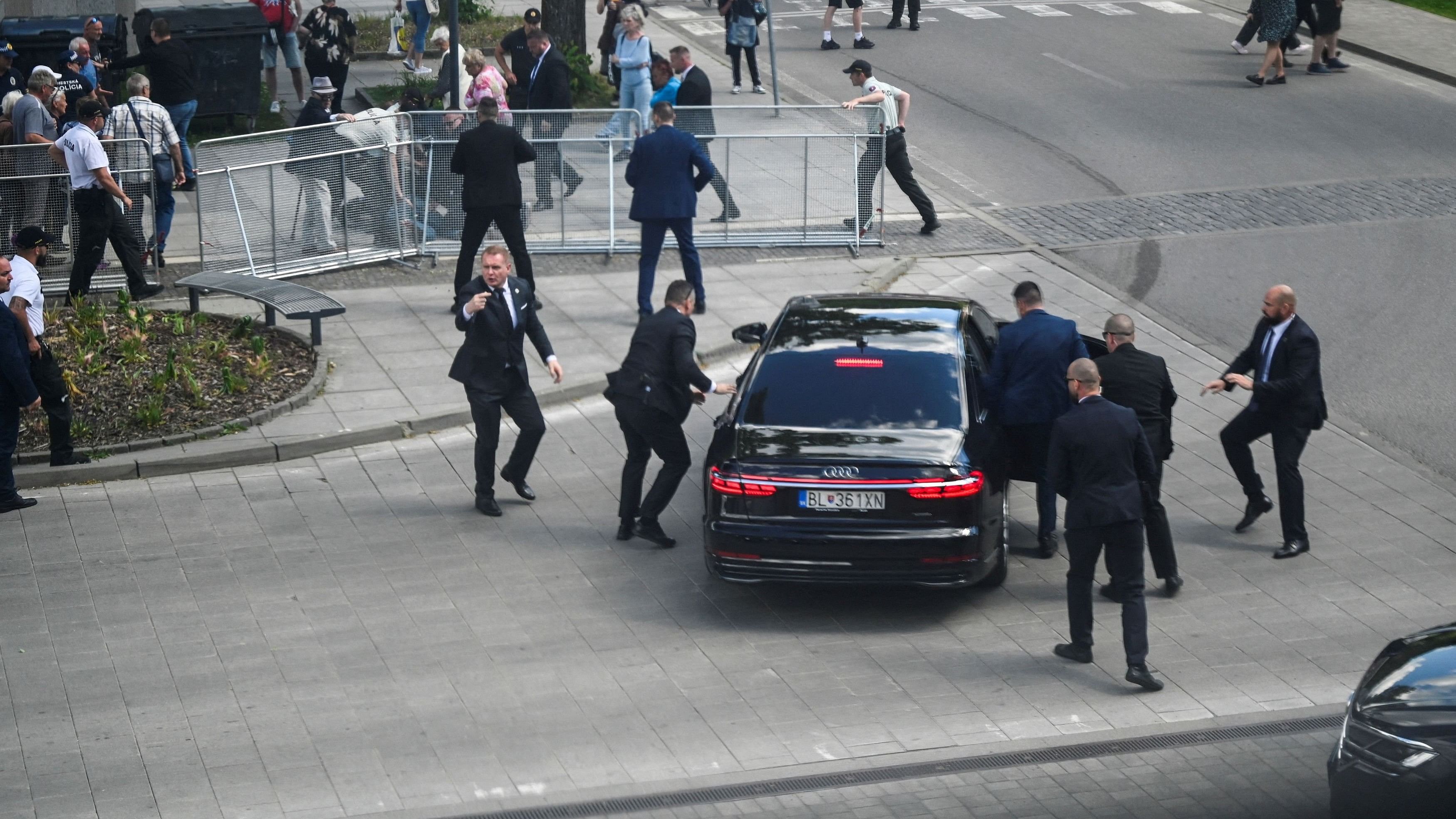 <div class="paragraphs"><p>Security officers move Slovak PM Robert Fico in a car after a shooting incident, after a Slovak government meeting in Handlova, Slovakia, May 15, 2024. </p></div>