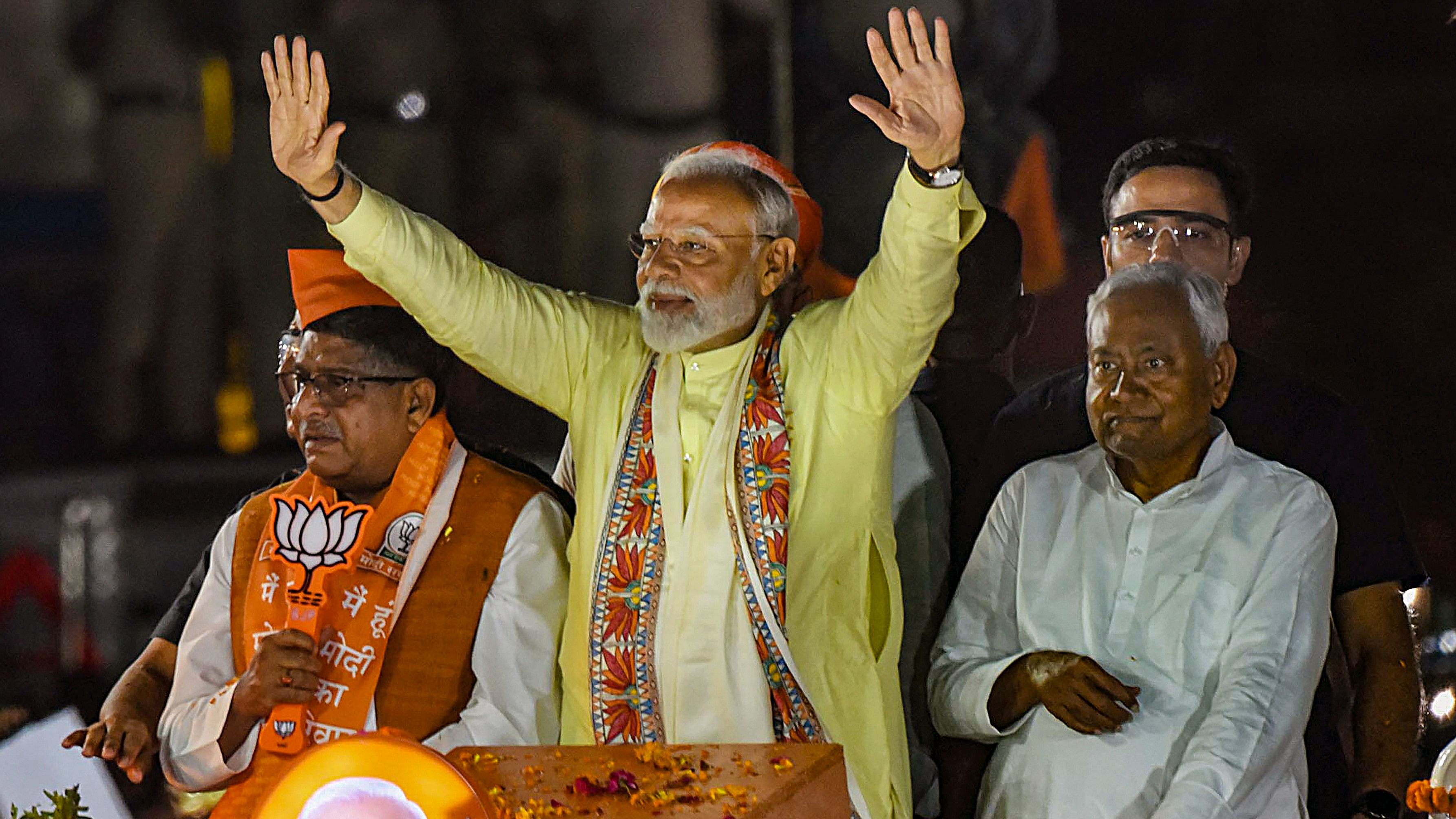 <div class="paragraphs"><p>PM Narendra Modi, Bihar Chief Minister Nitish Kumar and BJP candidate from Patna Sahib constituency Ravi Shankar Prasad during an election campaign roadshow for the Lok Sabha elections, in Patna, on Sunday.</p></div>