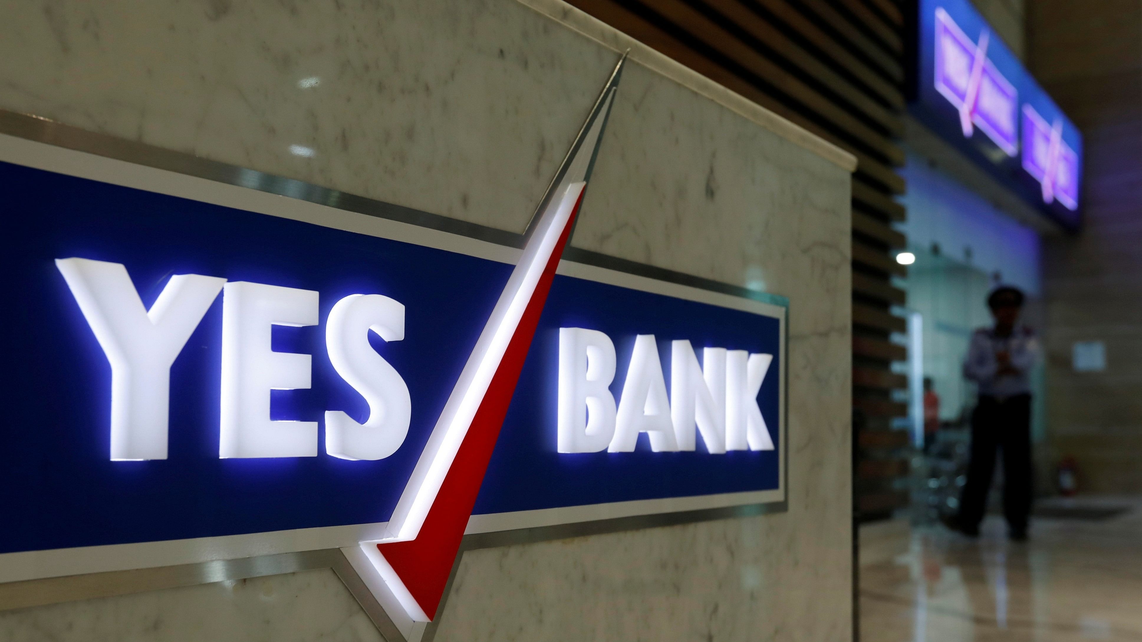 <div class="paragraphs"><p>A security guard stands outside a Yes Bank branch at its headquarters in Mumbai.</p></div>