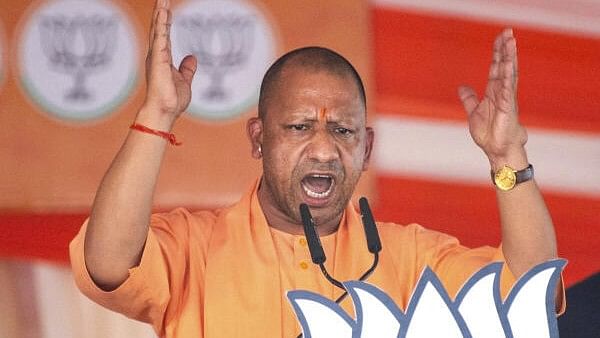 <div class="paragraphs"><p>Uttar Pradesh Chief Minister Yogi Adityanath speaks during a public meeting of Prime Minister Narendra Modi for Lok Sabha elections, in Lalganj, Azamgarh, Thursday, May 16, 2024.</p></div>