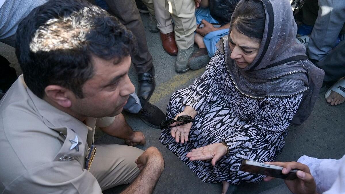 <div class="paragraphs"><p>PDP chief Mehbooba Mufti sits on a protest after the alleged detention of her party workers, on the day of voting in the sixth phase of Lok Sabha elections, in Anantnag district, Saturday, May 25, 2024.</p></div>