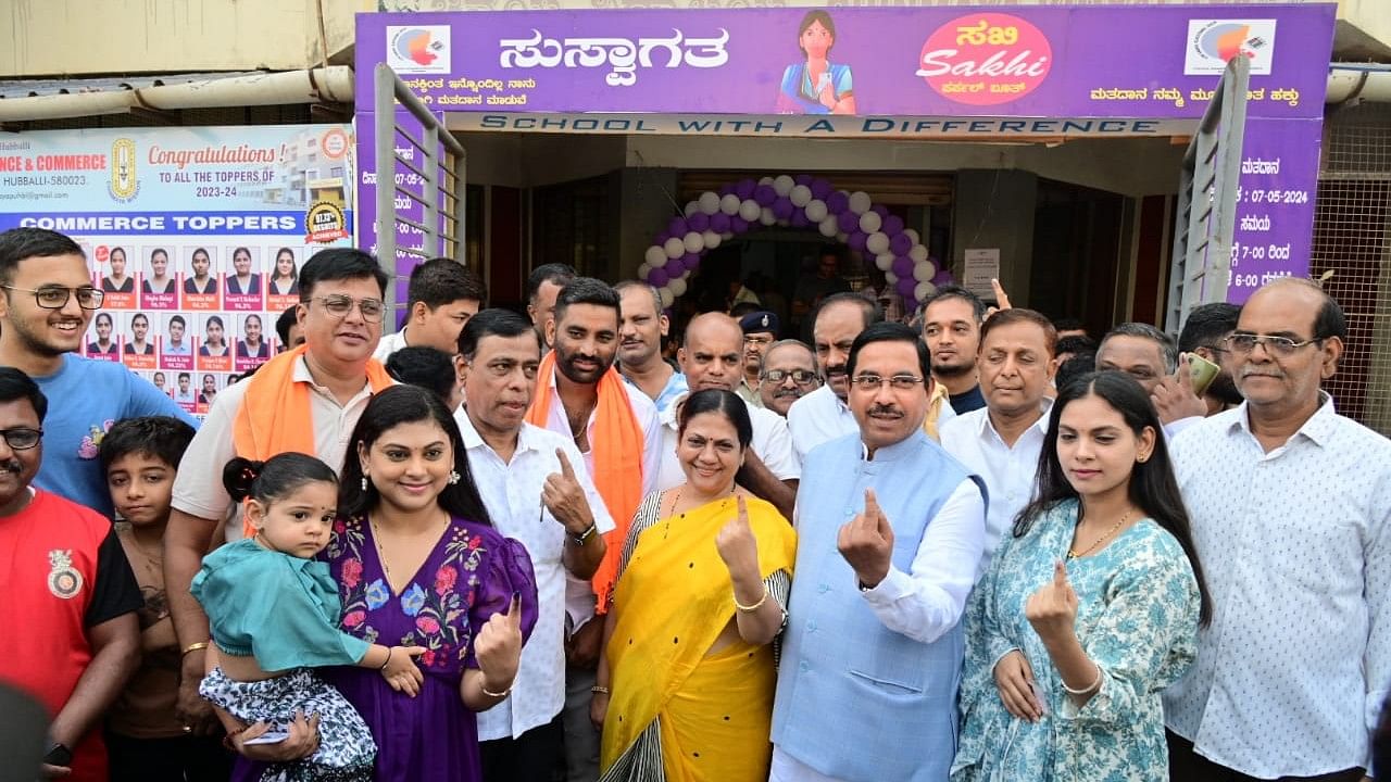 <div class="paragraphs"><p>Union minister and BJP candidate Pralhad Joshi with his family members after casting vote at the polling station set up at Chinmaya Vidyalaya at Vivekanand Colony in Hubballi on Tuesday.</p></div>