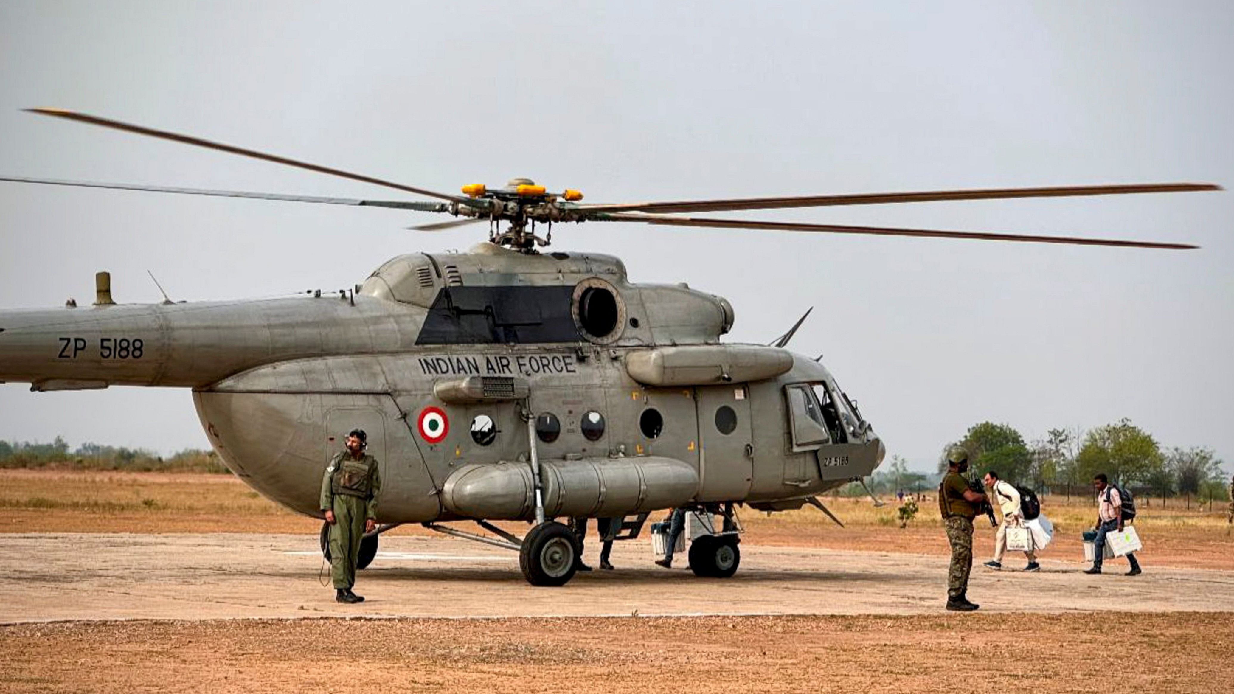 <div class="paragraphs"><p>Security personnel stand guard as polling officials with the election material board an Indian Air Force helicopter to be dispatched to Maoist-hit areas in Singhbhum Lok Sabha constituency, ahead of the fourth phase of Lok Sabha elections. </p></div>