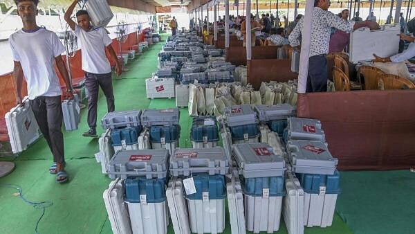 <div class="paragraphs"><p>Electronic Voting Machines (EVMs) and other election material placed at a distribution centre, a day before voting in the fourth phase of Lok Sabha elections.</p></div>