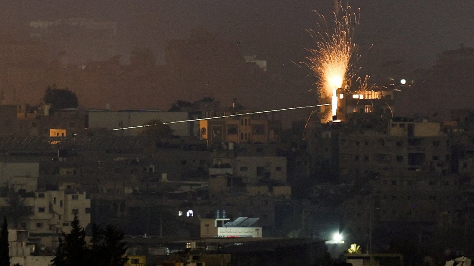 <div class="paragraphs"><p>A missile hits a building in northern Gaza, amid the ongoing conflict between Israel and the Palestinian Islamist group Hamas, as seen from Israel, May 11, 2024. </p></div>