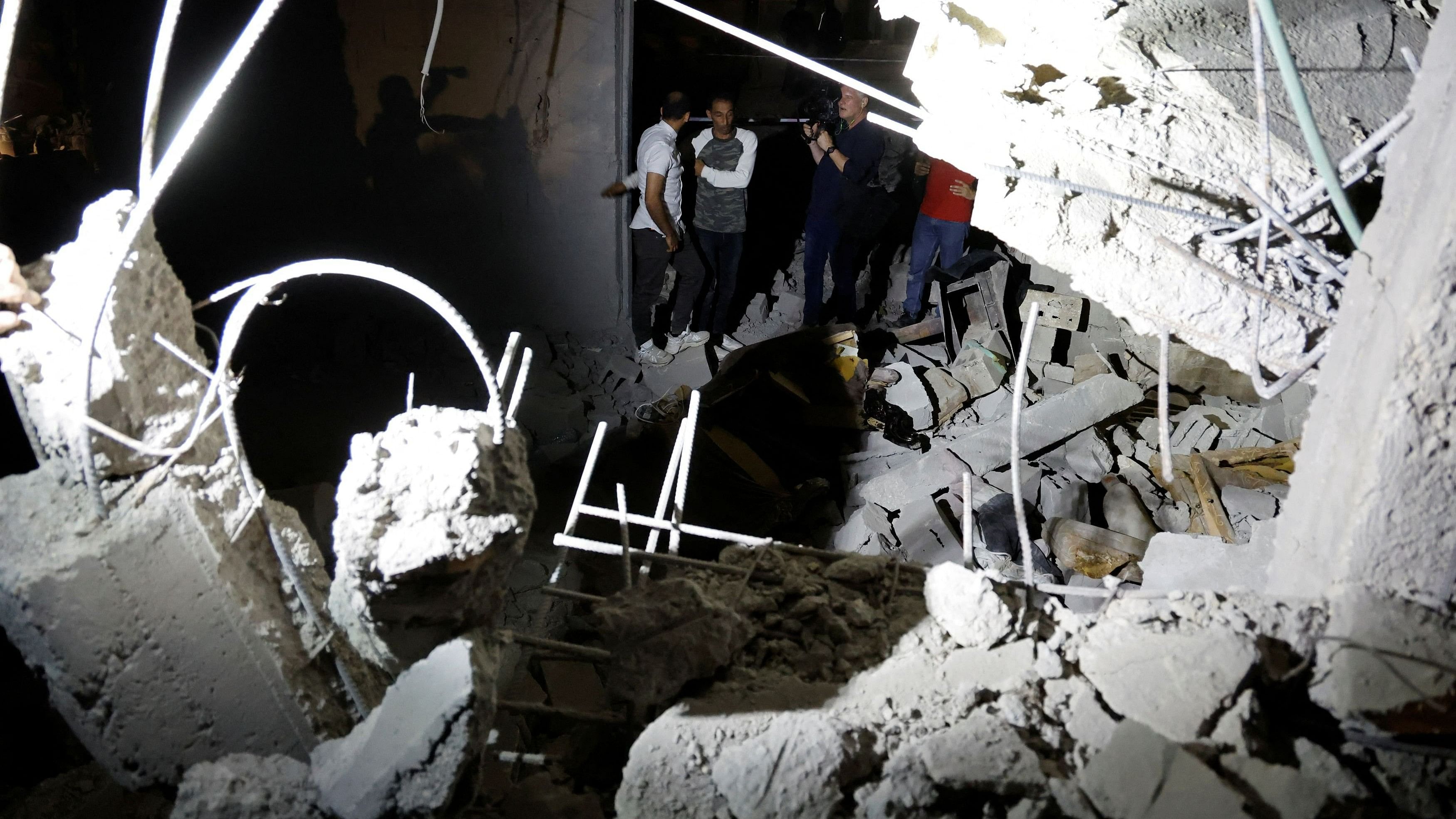 <div class="paragraphs"><p>Palestinians inspect the site of an Israeli military airstrike, in the area of Jenin, in the Israeli-occupied West Bank, May 18, 2024. </p></div>