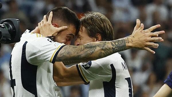 <div class="paragraphs"><p>Real Madrid's Joselu and Luka Modric celebrate after the match.</p></div>