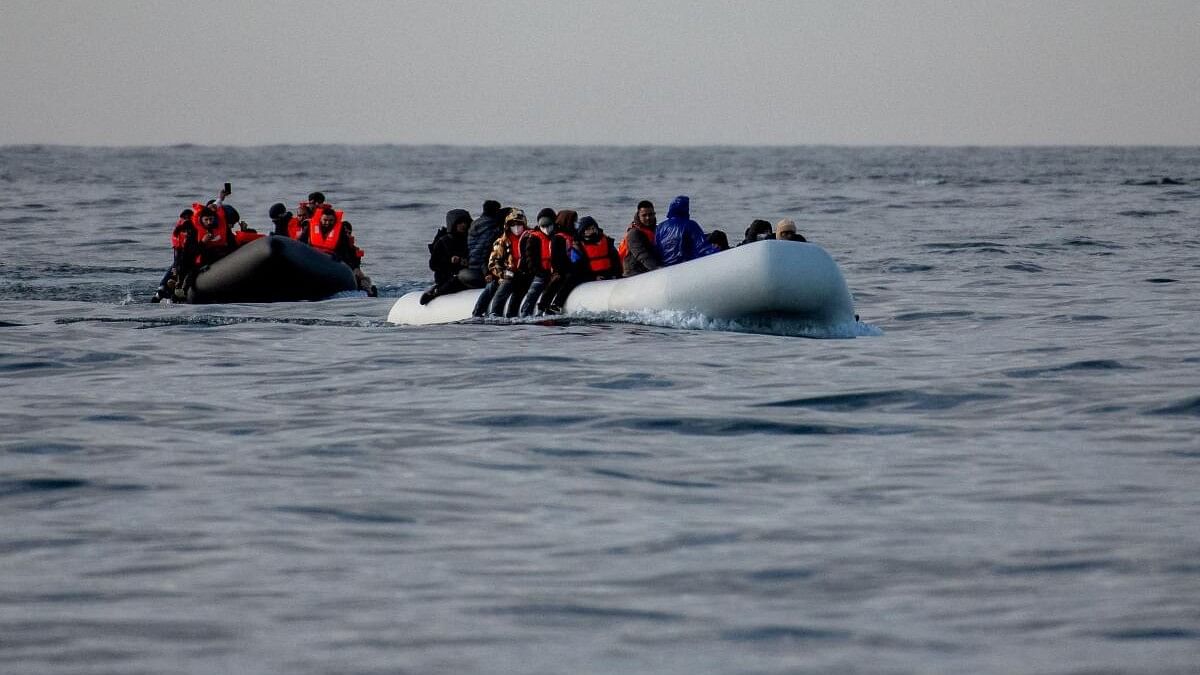 <div class="paragraphs"><p>Two inflatable dinghies carrying migrants make their way towards England in the English Channel.</p></div>