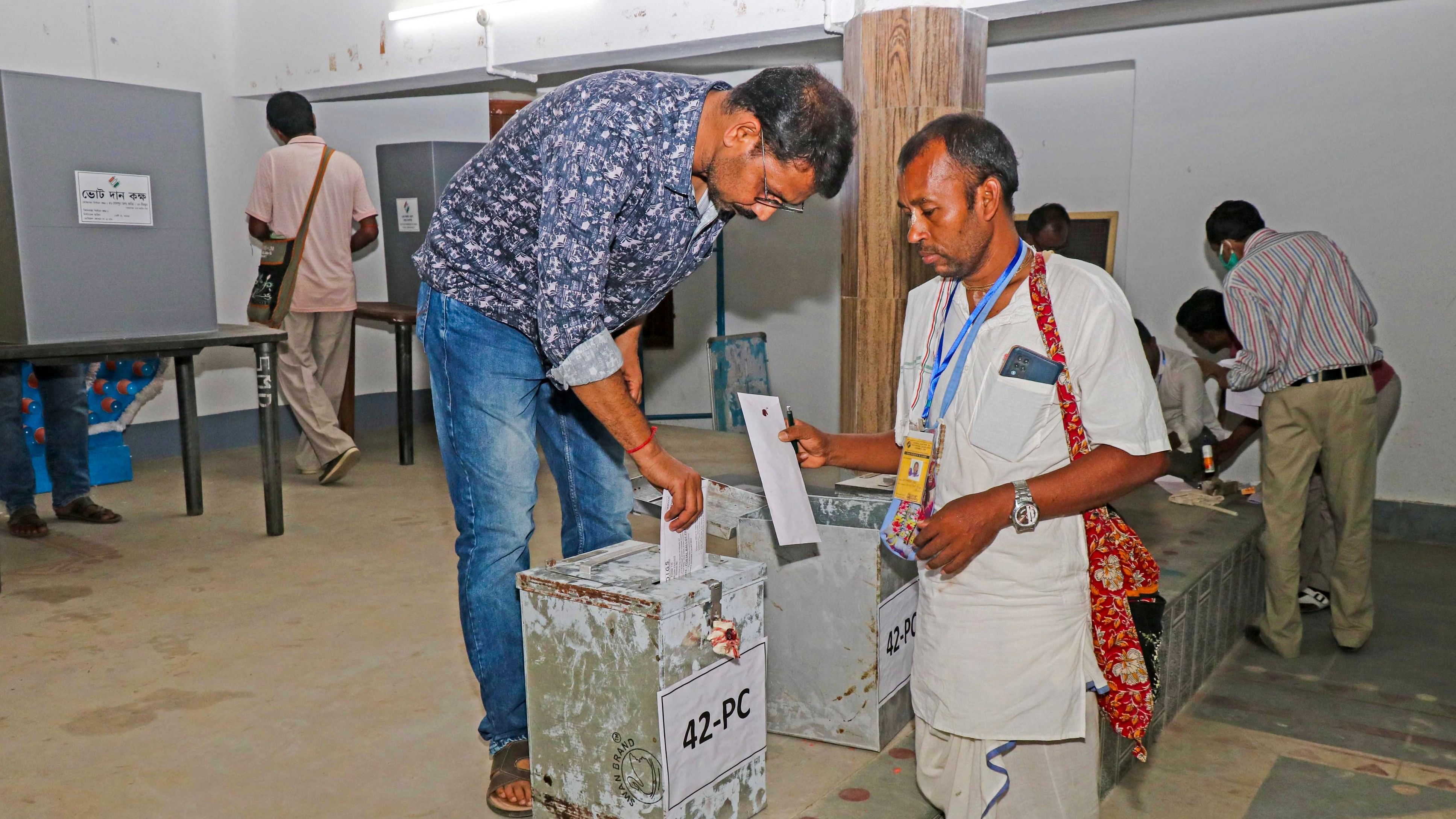 <div class="paragraphs"><p>Polling officials cast their votes through postal ballot for Lok Sabha elections, at Bolpur in Birbhum, Saturday, May 4, 2024. </p></div>