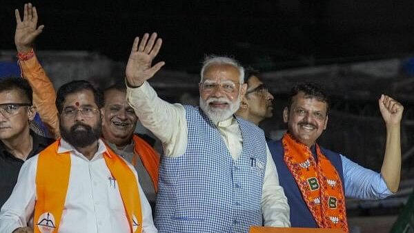 <div class="paragraphs"><p>Prime Minister Narendra Modi, Maharashtra Chief Minister Eknath Shinde and Deputy Chief Minister Devendra Fadnavis during a roadshow, for Lok Sabha polls, in Mumbai On May 15</p></div>