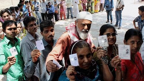 <div class="paragraphs"><p>Voters queue to cast their votes in Assam.</p></div>