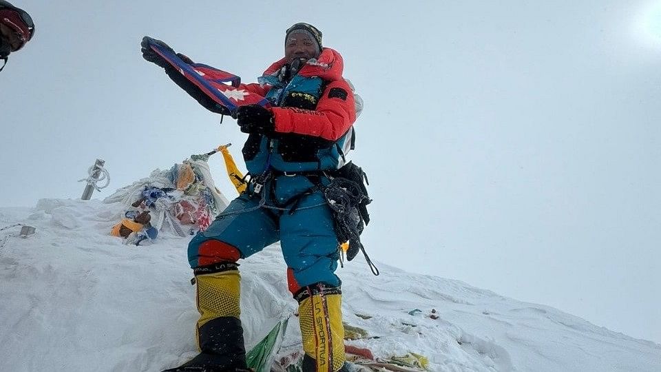 <div class="paragraphs"><p>Kami Rita Sherpa poses for a photo at the summit of Mount Everest, May 22, 2024.</p></div>