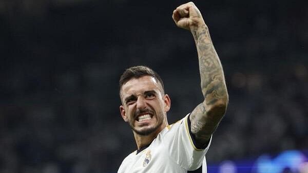 <div class="paragraphs"><p>Real Madrid's Joselu celebrates after the match</p></div>