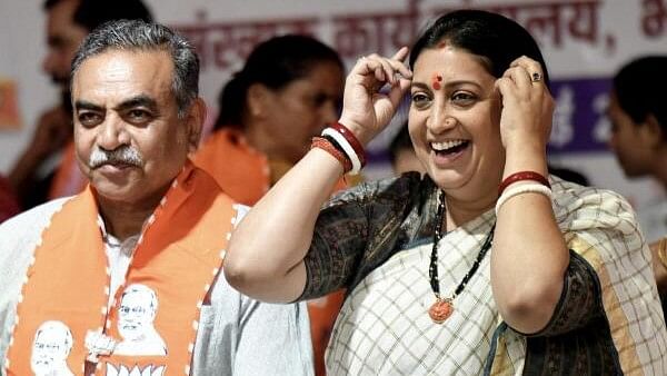 <div class="paragraphs"><p>Union Minister Smriti Irani with BJP candidate from Chandigarh constituency Sanjay Tandon during a public meeting for Lok Sabha elections, in Chandigarh, Tuesday, May 28, 2024.</p></div>