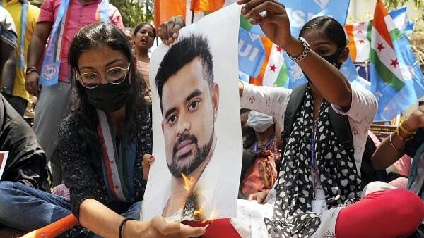 <div class="paragraphs"><p>A poster of Prajwal Revanna being burnt amid the sex abuse row in Hassan.</p></div>
