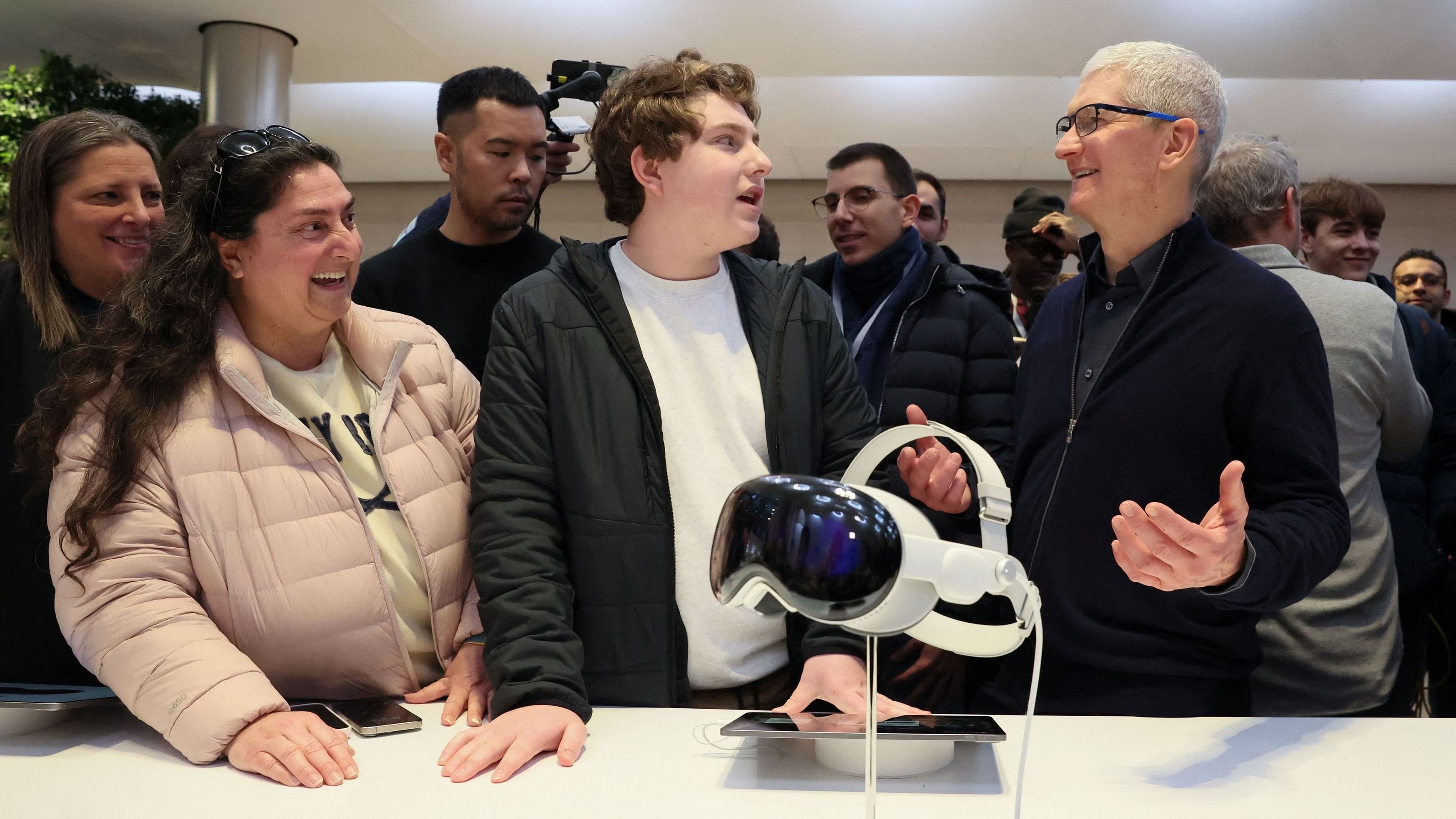 <div class="paragraphs"><p>Apple CEO Tim Cook talks with customers as Apple's Vision Pro headset is displayed at the Apple Fifth Avenue store in Manhattan in New York City, US.</p></div>