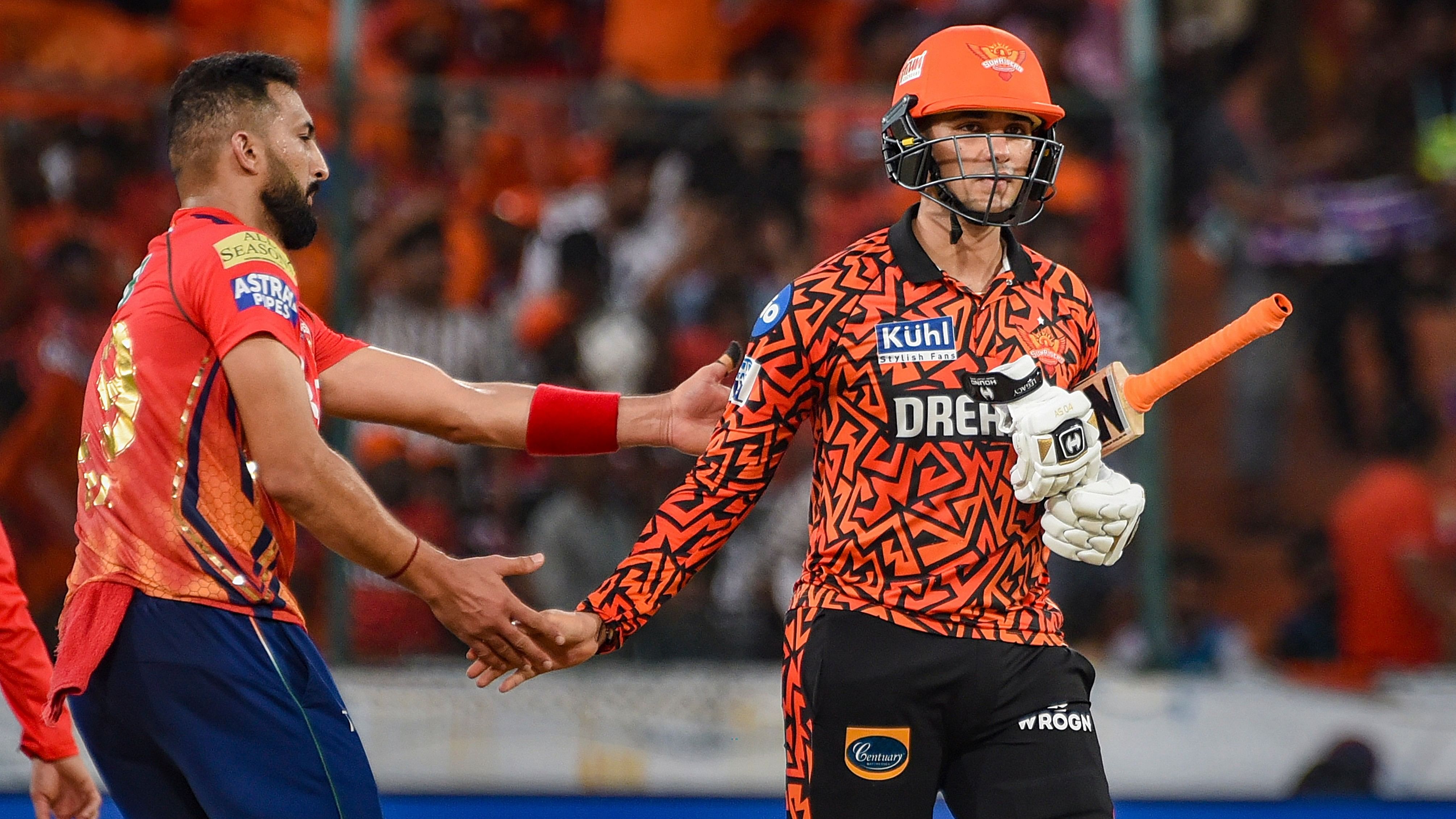 <div class="paragraphs"><p>Punjab Kings player Rishi Dhawan congratulates Sunrisers Hyderabad batter Abhishek Sharma for his half century during the Indian Premier League (IPL) 2024 T20 cricket match between Sunrisers Hyderabad (SRH) and Punjab Kings (PBKS), at the Rajiv Gandhi International Stadium, Uppal, in Hyderabad, Sunday, May 19, 2024. </p></div>