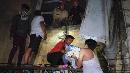 <div class="paragraphs"><p>A newborn baby being rescued from the Baby Care New Born Hospital after a fire broke out, in East Delhi, Saturday, May 25, 2024.</p></div>