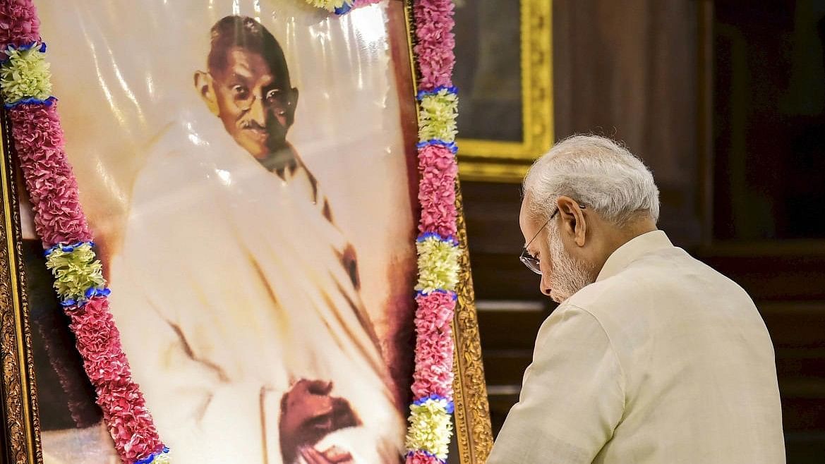 <div class="paragraphs"><p>File photo of PM Narendra Modi paying tribute to Mahatma Gandhi.&nbsp;</p></div>