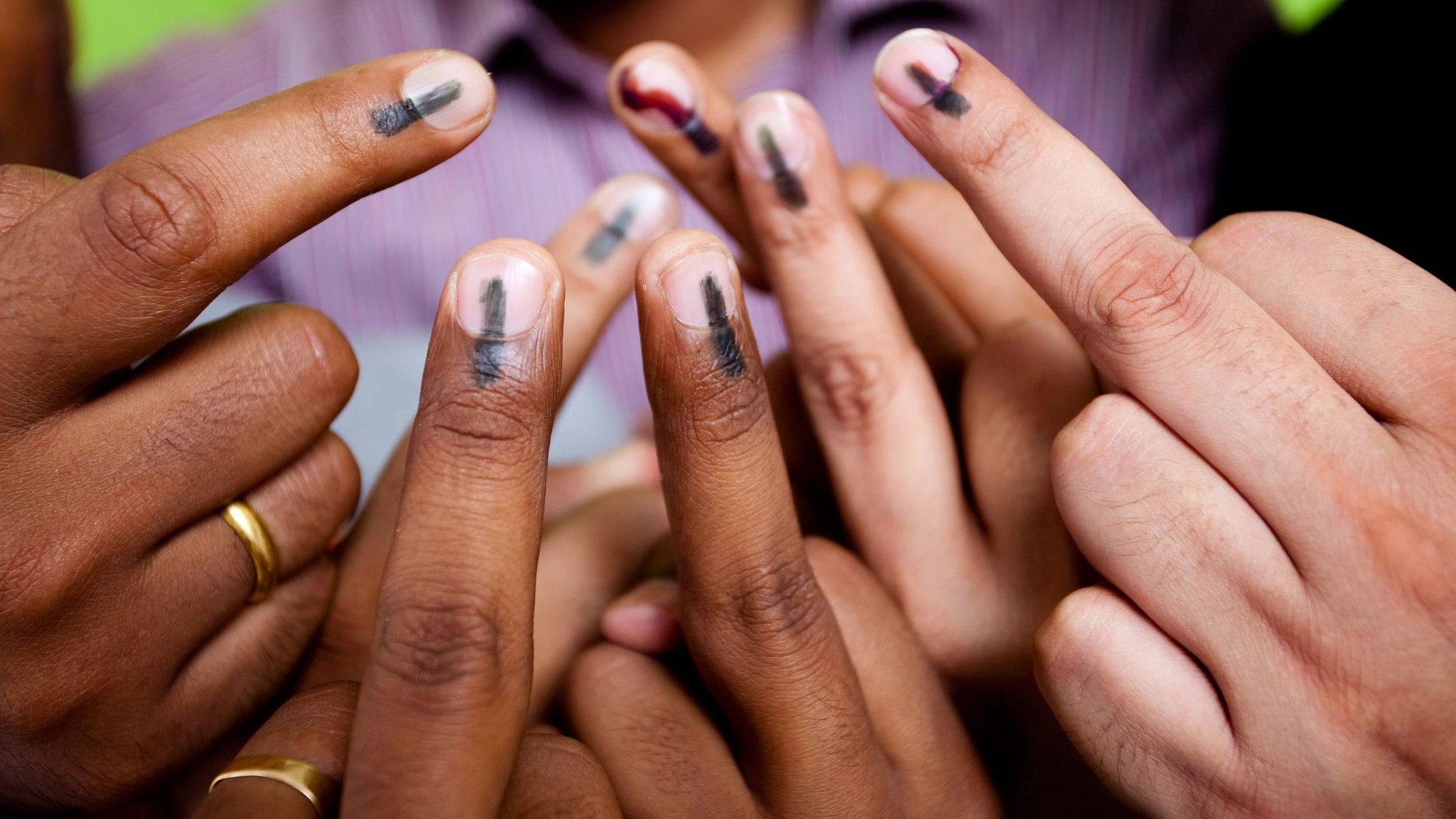 <div class="paragraphs"><p>Representative image showing voters with inked fingers</p></div>