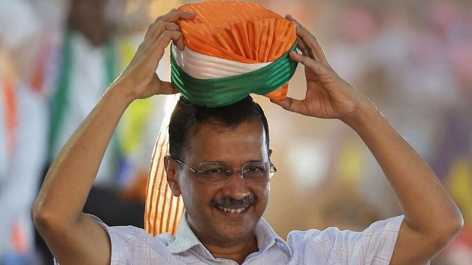 <div class="paragraphs"><p>Delhi's Chief Minister Arvind Kejriwal wears a turban offered to him at a roadshow, in New Delhi.</p></div>