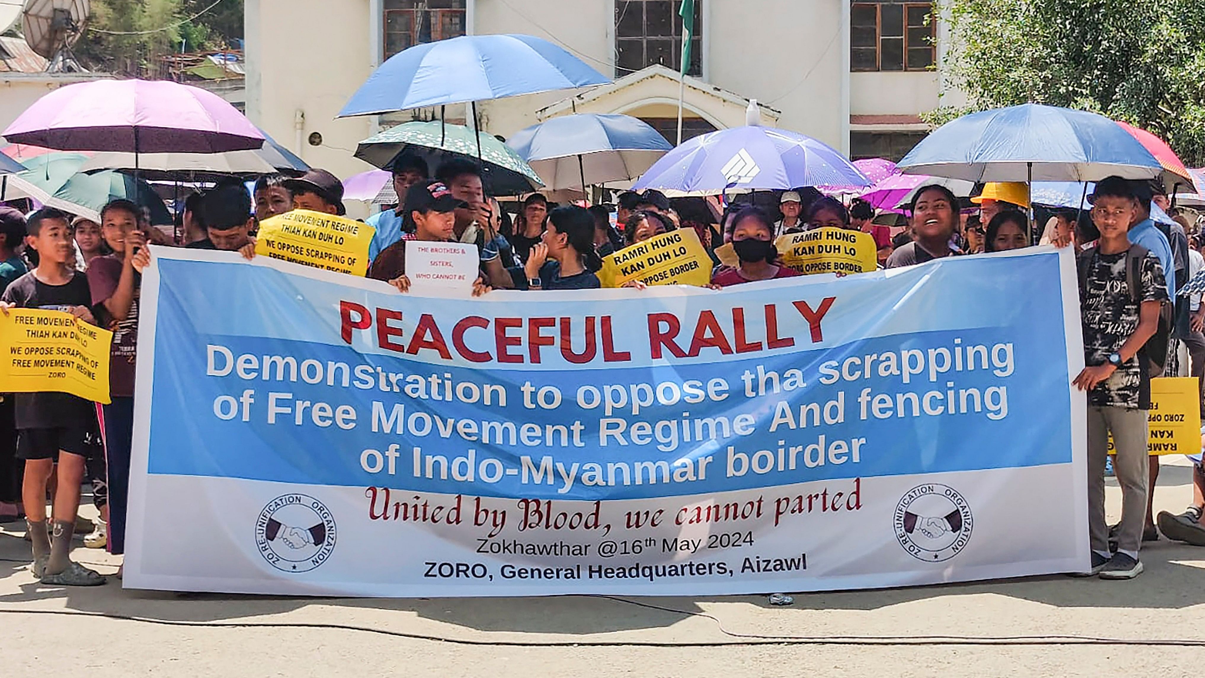 <div class="paragraphs"><p> Champai: Activists carry a banner during a rally against scrapping of the Free Movement Regime (FMR), at Zokhawthar village along the India-Myanmar border, in Champhai district of Mizoram, Thursday, May 16.</p></div>