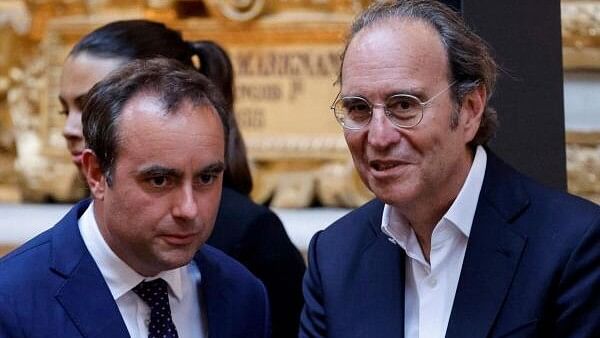 <div class="paragraphs"><p>France's Minister for the Armed Forces Sebastien Lecornu (left) and French CEO of Iliad group and Free Telecom Xavier Niel attend the seventh "Choose France Summit", aiming to attract foreign investors to the country, at the Chateau de Versailles, outside Paris, on May 13, 2024.</p></div>