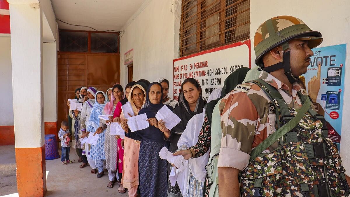 <div class="paragraphs"><p>Poonch: People wait in a queue at a polling station during sixth phase of Lok sabha elections near Line of Control (LoC), in Poonch.</p></div>