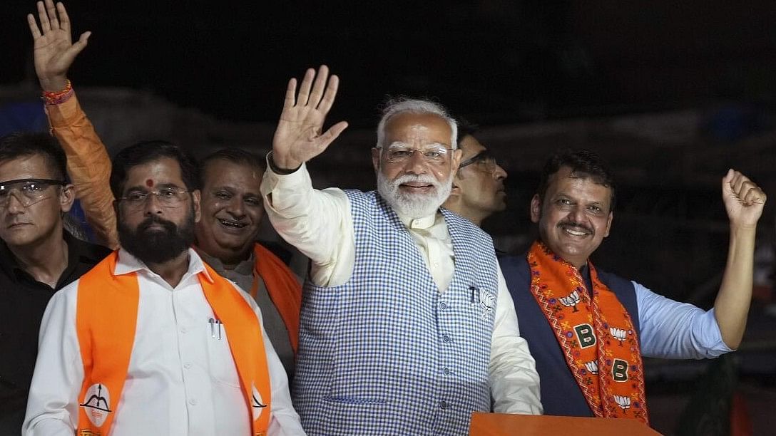 <div class="paragraphs"><p>PM Narendra Modi, Maharashtra Chief Minister Eknath Shinde and Deputy Chief Minister Devendra Fadnavis during a roadshow, for Lok Sabha polls, in Mumbai.&nbsp;</p></div>