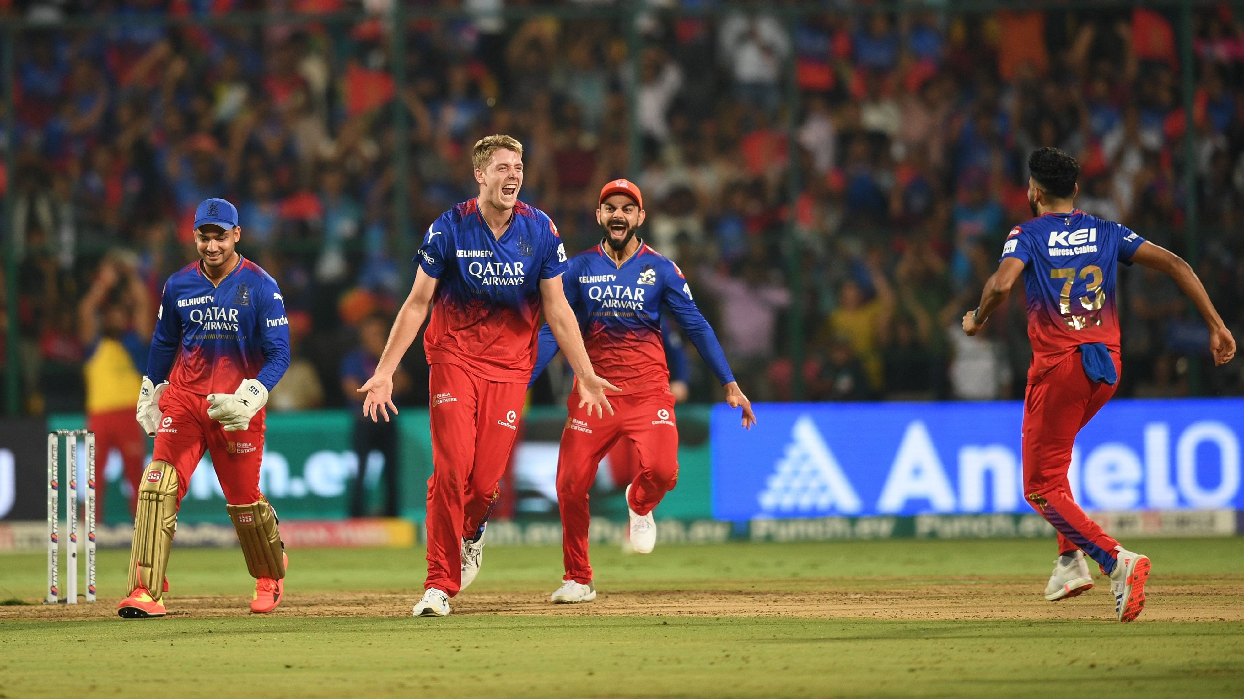 <div class="paragraphs"><p>Royal Challengers Bengaluru's Cameron Green celebrates with team mates after taking the wicket of Delhi Capitals' Tristan Stubbs during the Indian Premier League (IPL) 2024 cricket match between Royal Challengers Bengaluru and Delhi Capitals, at M Chinnaswamy stadium in Bengaluru on Sunday. </p></div>