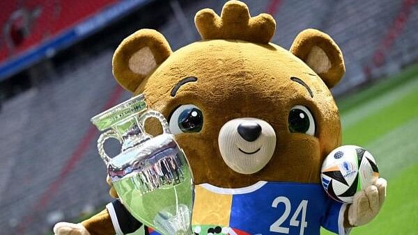 <div class="paragraphs"><p> Euro 2024 mascot Albart poses with the European Championship trophy.</p></div>