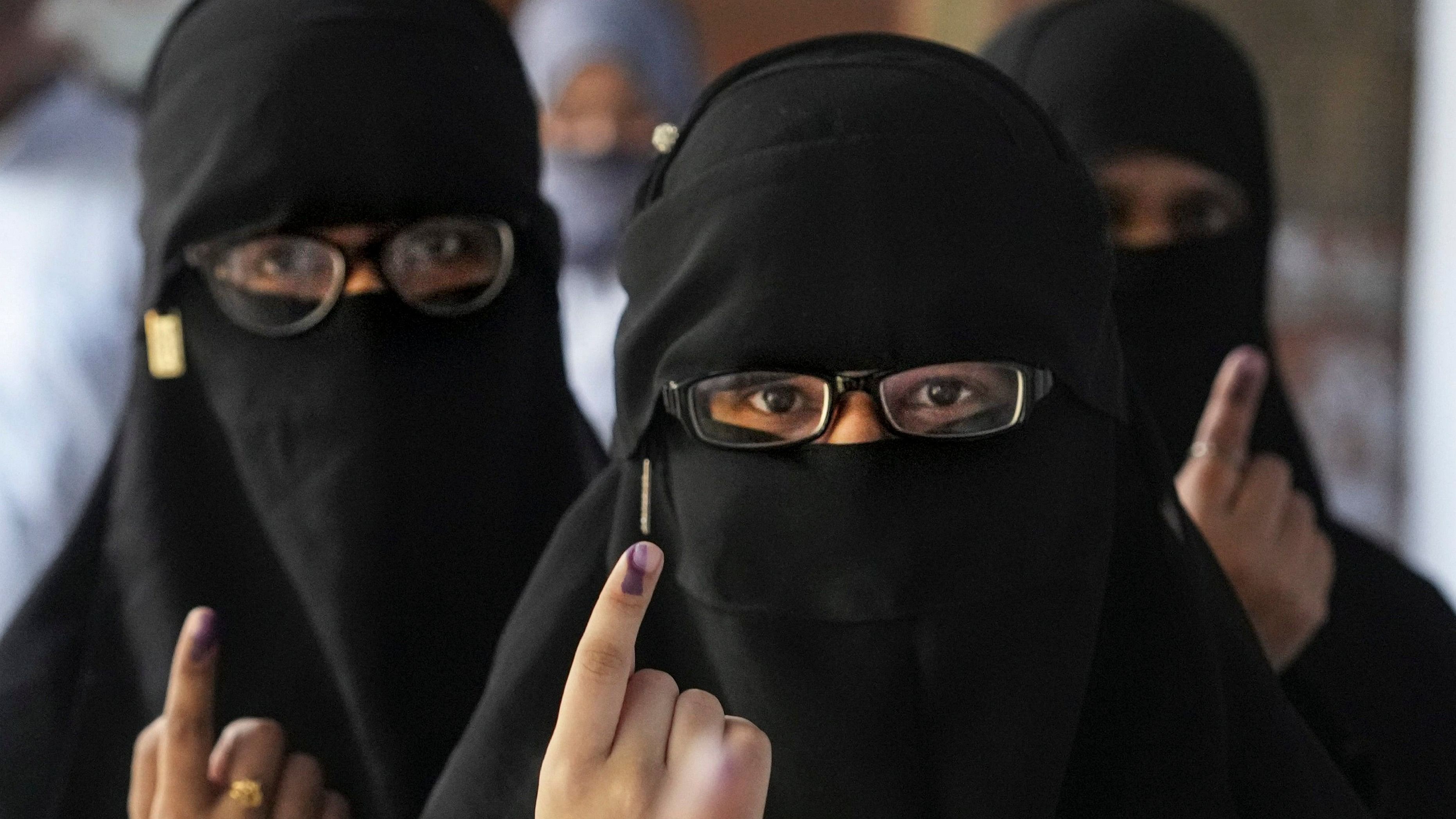 <div class="paragraphs"><p> People show their inked fingers after casting votes at a polling station. Image forrepresentation only.&nbsp;</p></div>