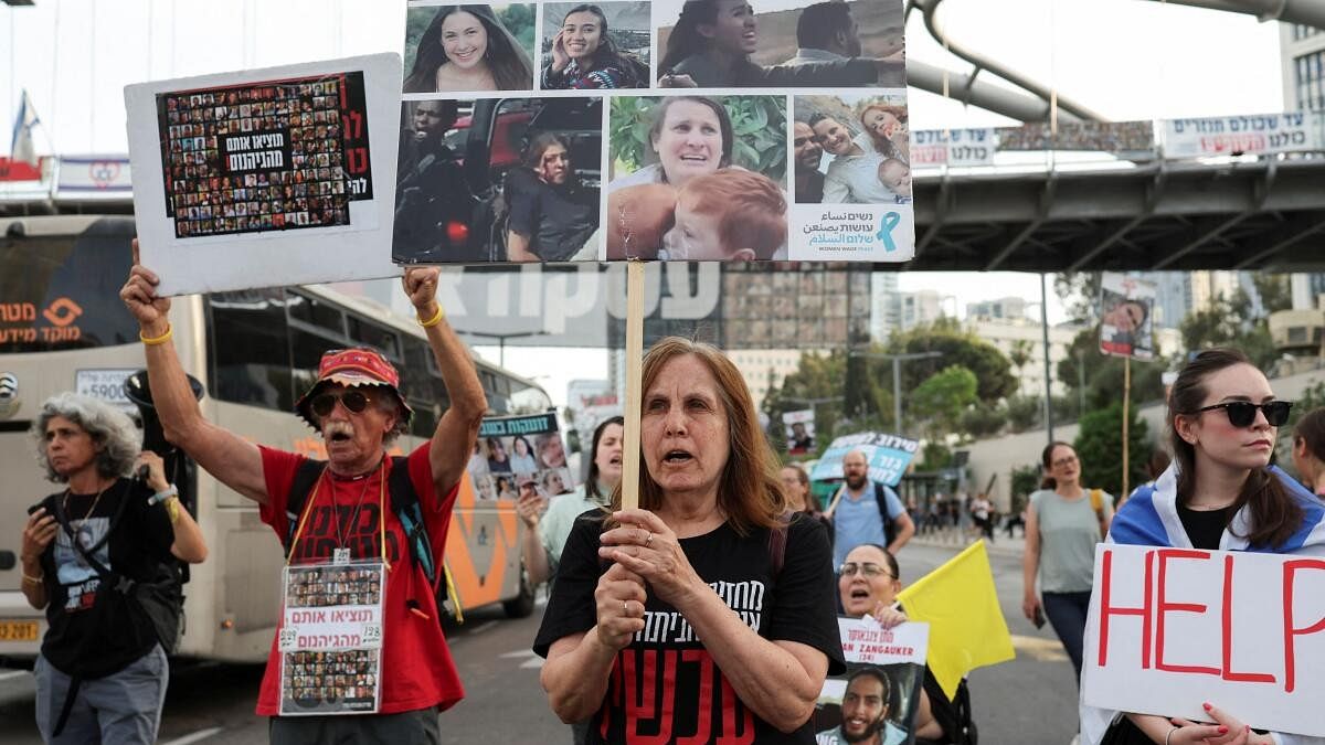 <div class="paragraphs"><p>People take part in a protest demanding the immediate release of hostages, after the release of a video showing the capture of female Israeli soldiers before they were taken to Gaza during the deadly October 7 attack by Palestinian Islamist group Hamas, near the Ministry of Defence in Tel Aviv, Israel.</p></div>