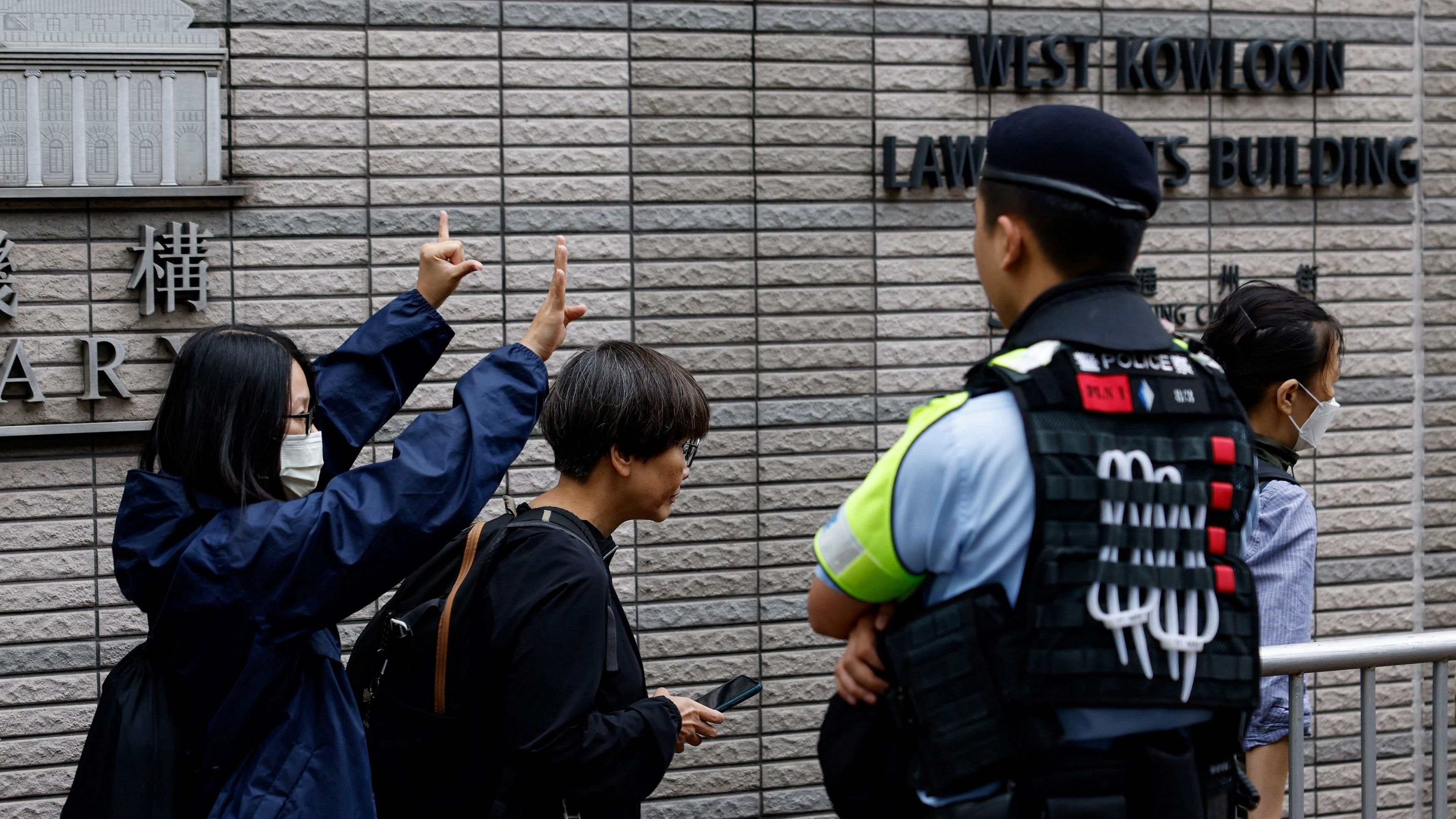 <div class="paragraphs"><p>A supporter gestures outside the West Kowloon Magistrates' Courts building, before the verdict of the&nbsp;47&nbsp;pro-democracy&nbsp;activists&nbsp;charged under the national security law, in Hong Kong, China, May 30, 2024. </p></div>