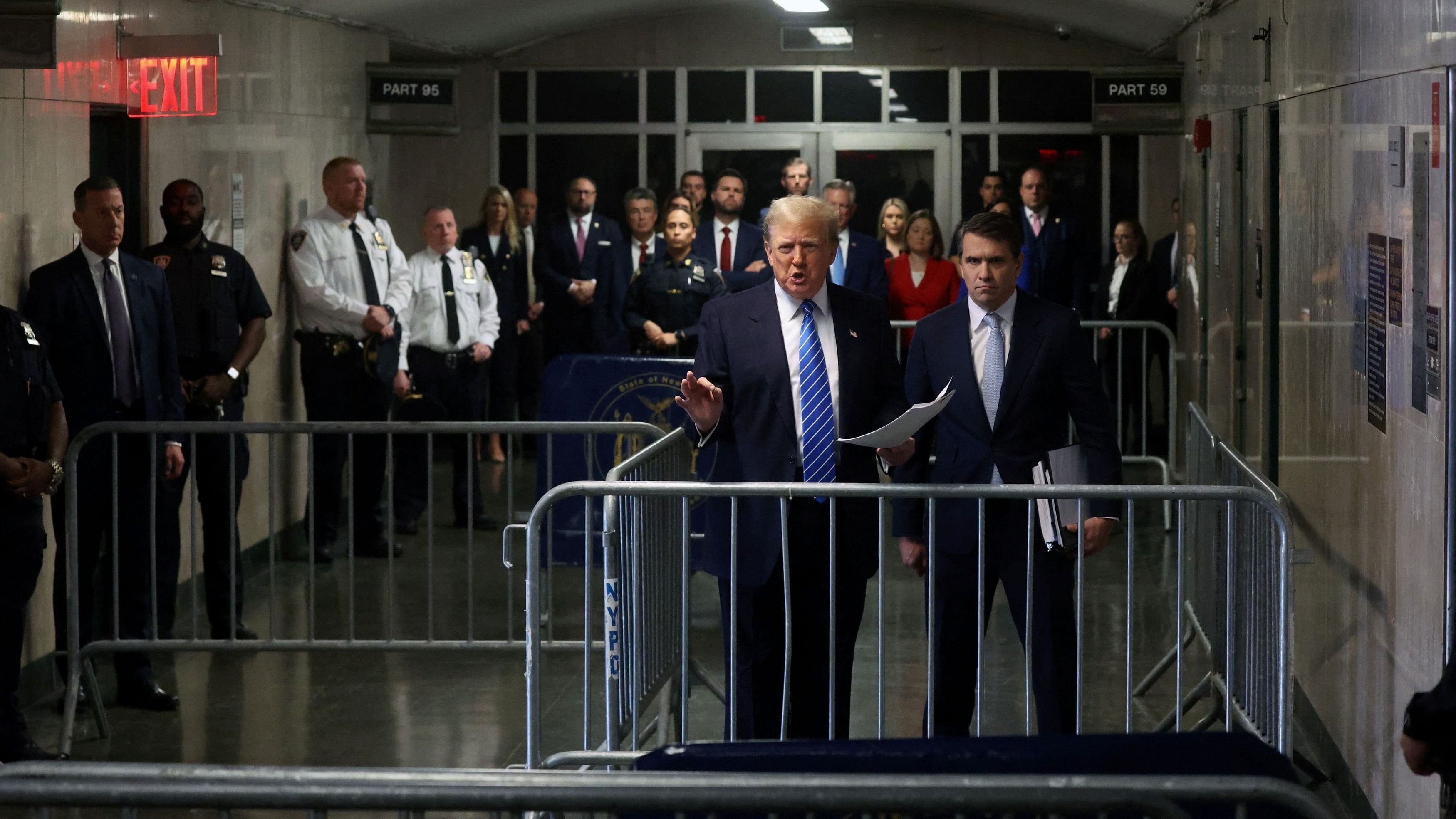 <div class="paragraphs"><p> Former US President Donald Trump speaks to the media with attorney Todd Blanche as he attends his trial for allegedly covering up hush money payments at Manhattan Criminal Court on May 13, 2024 in New York City. </p></div>