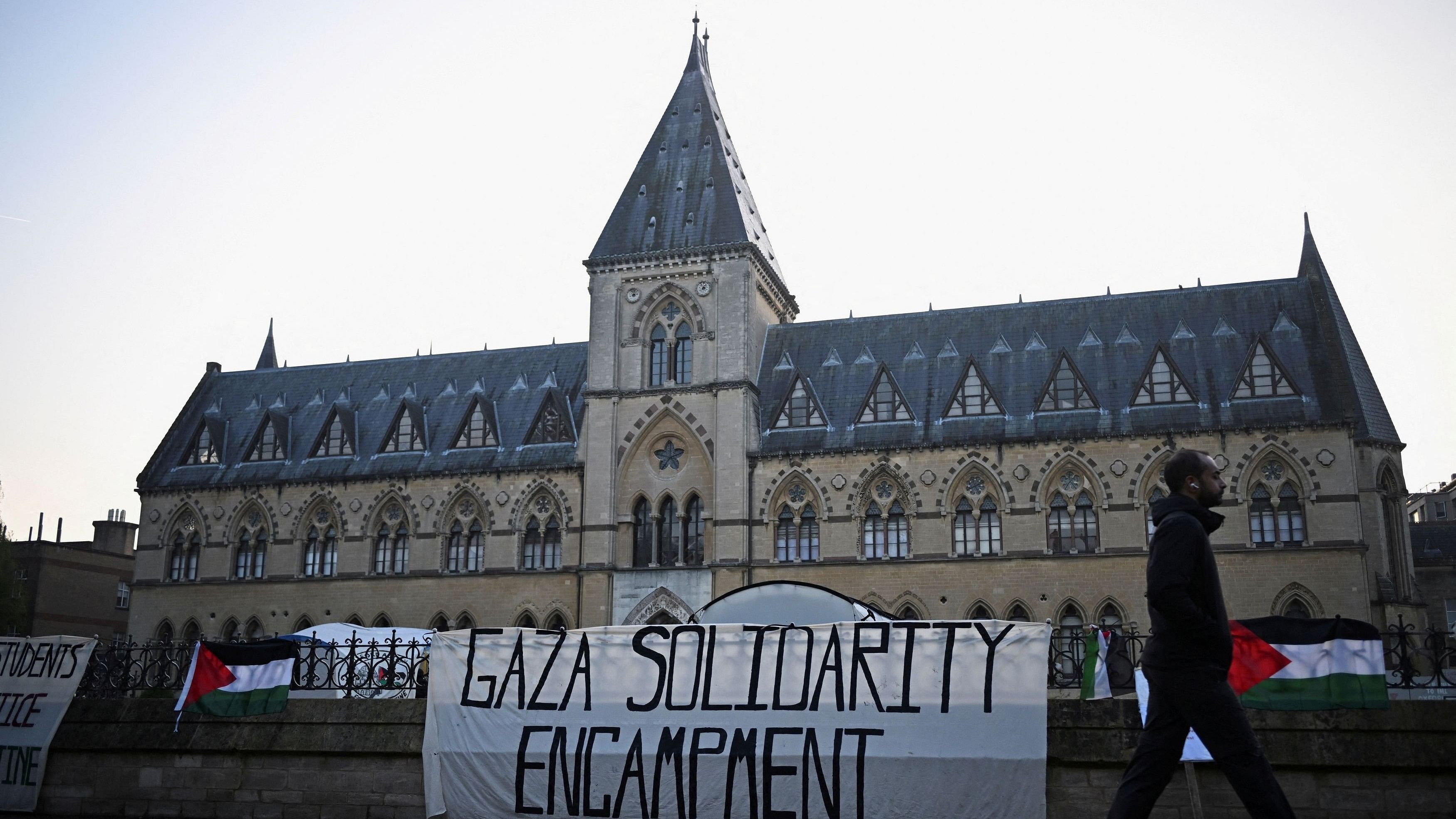 <div class="paragraphs"><p>A person walks past Oxford University Museum of Natural History, as students occupy parts of British university campuses to protest in support of Palestinians in Gaza, amidst the ongoing war between Israel and the Palestinian Islamist group Hamas, in Oxford, Britain, May 7, 2024. </p></div>