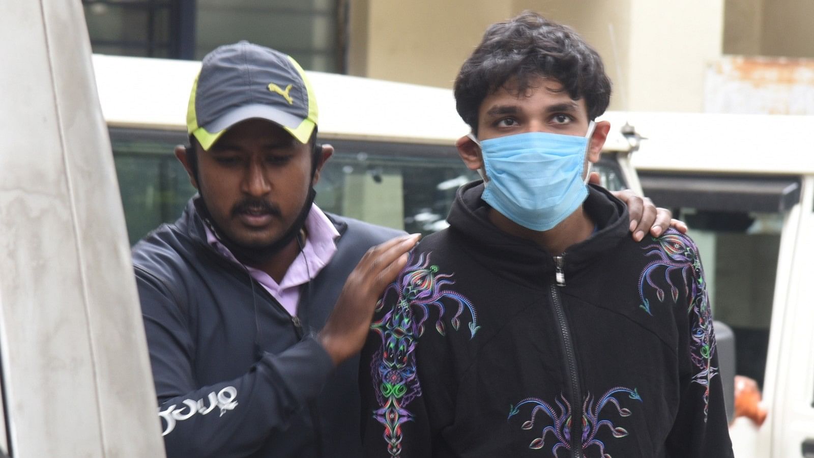 <div class="paragraphs"><p>Srikrishna alias Sriki (right) at the CCB office in Bengaluru on December 3, 2020. </p></div>